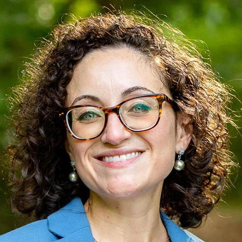 Headshot image of Dr. Danielle Arigo smiling.